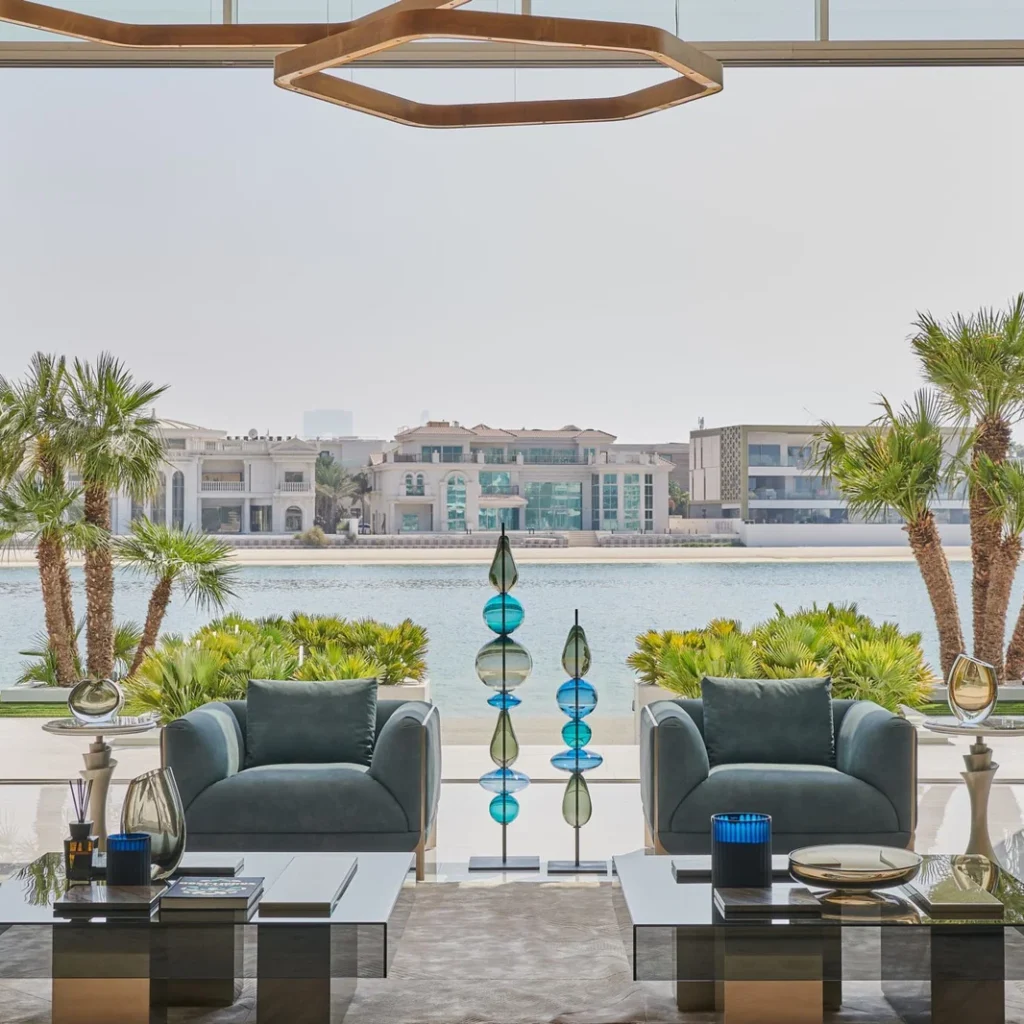 Villa renovation in Dubai waterfront lounge with contemporary seating and panoramic water views