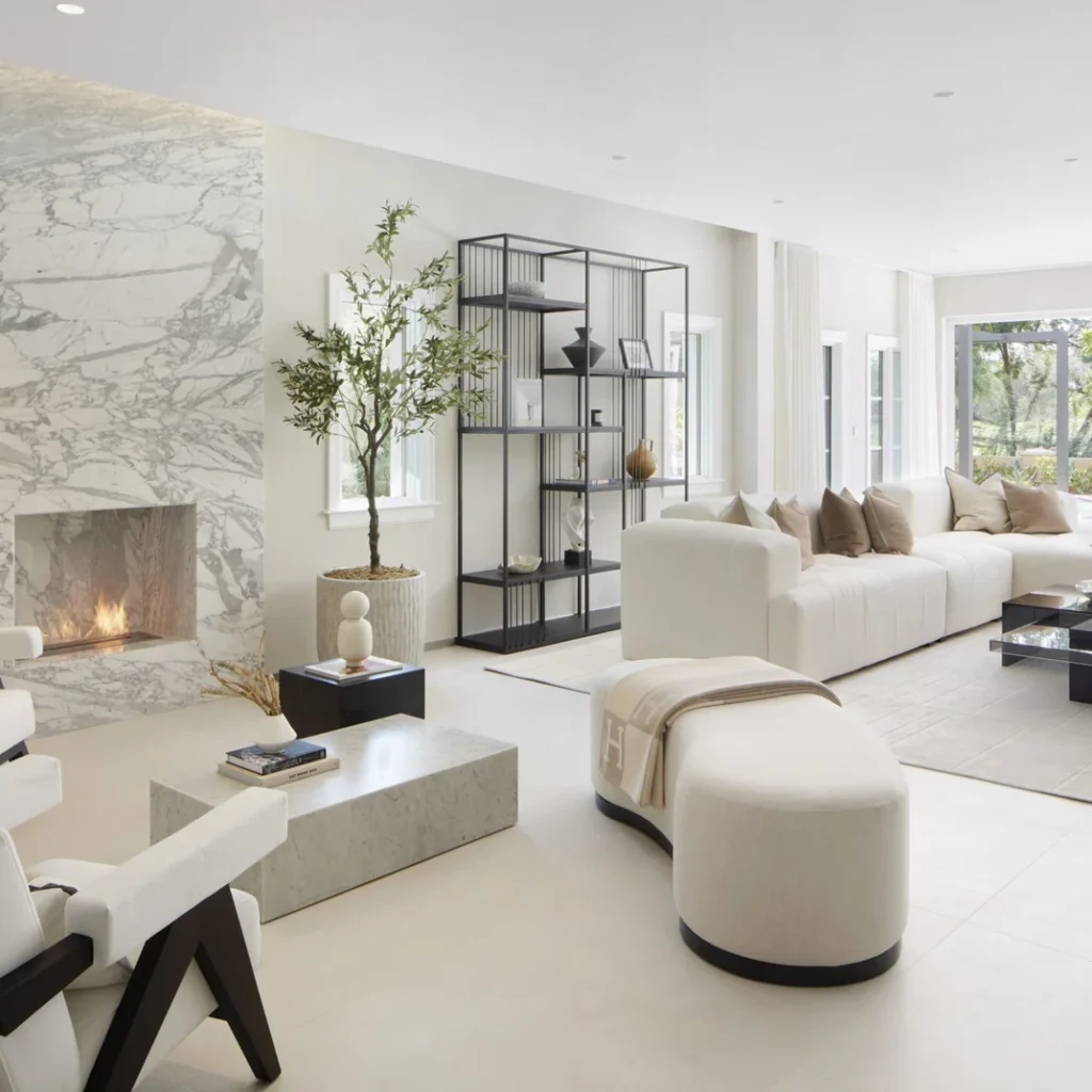 Residential apartment fit out in Dubai featuring a bright living room, marble fireplace and contemporary finishes