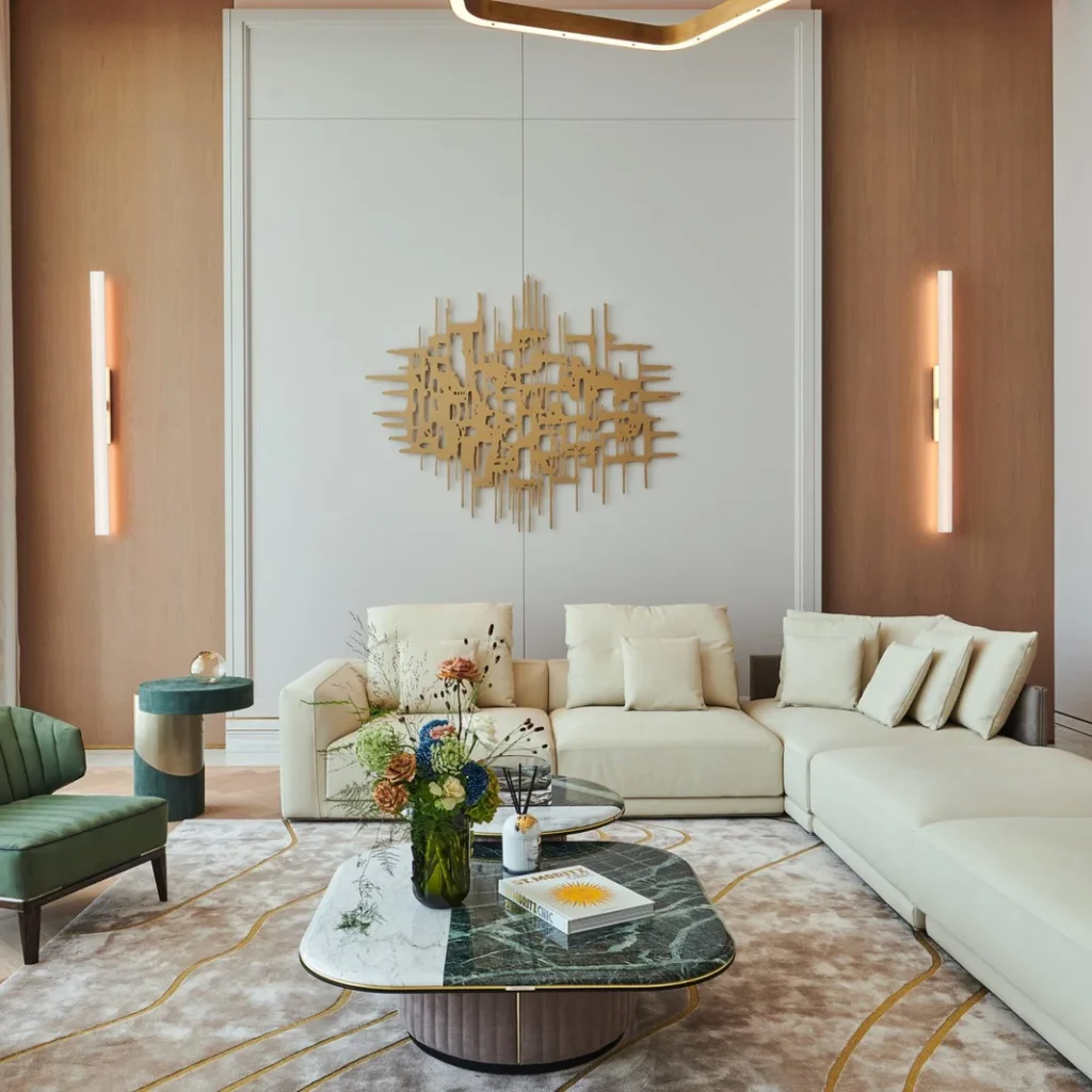 Villa renovation in Dubai formal lounge with custom wall paneling, sectional sofa and marble tables