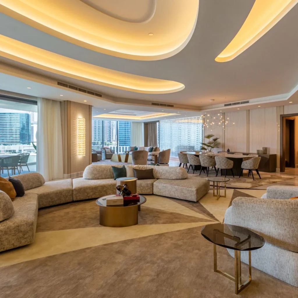 Turnkey penthouse fit out in Dubai featuring open-plan living and dining areas with integrated ceiling lighting