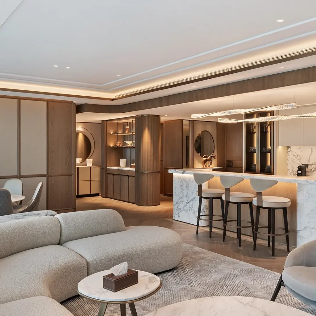 Apartment interior fit out in Dubai featuring an open-plan living room, marble kitchen counter and custom joinery