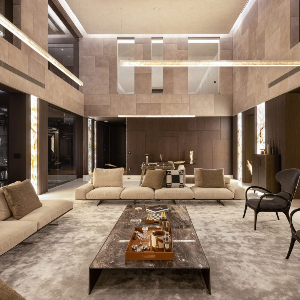 Villa interior fit out in Dubai featuring a large living room with stone finishes and custom wall paneling