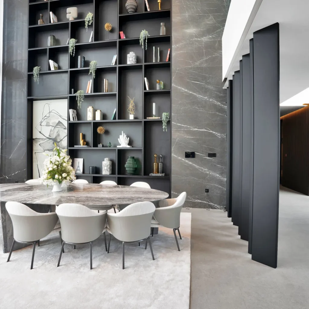 Villa dining room fit out in Dubai with custom shelving, stone finishes and bespoke interior detailing