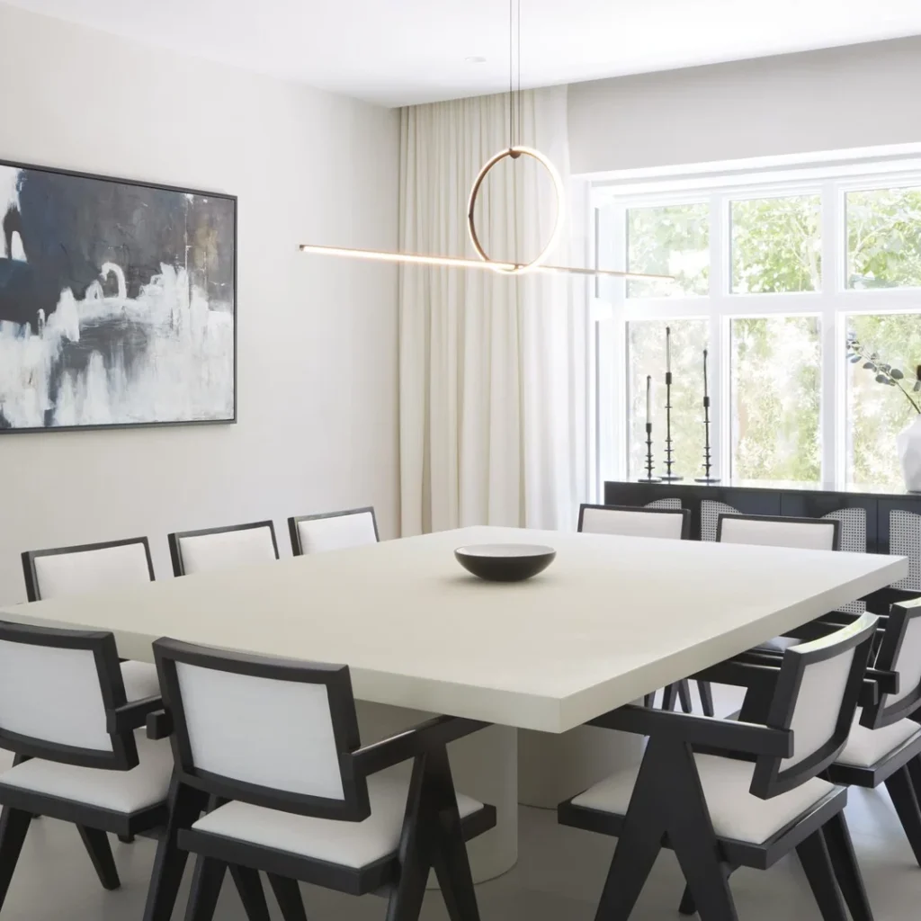 Apartment dining room fit out in Dubai featuring a custom dining area, statement lighting and contemporary finishes
