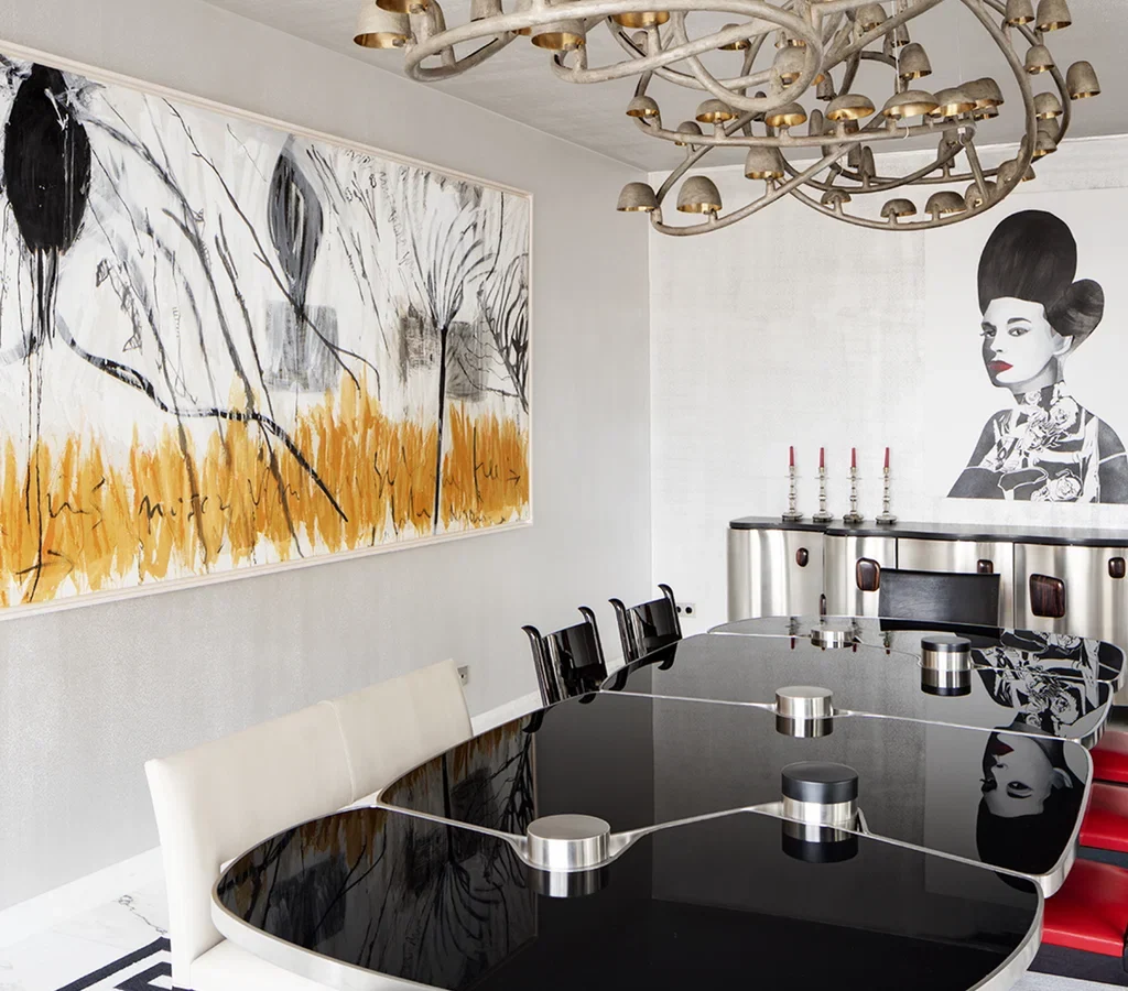 Apartment renovation in Dubai featuring a sculptural staircase, marble flooring and contemporary living area