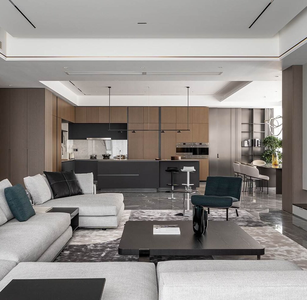 Penthouse interior design in Dubai featuring an open-plan living room and contemporary kitchen