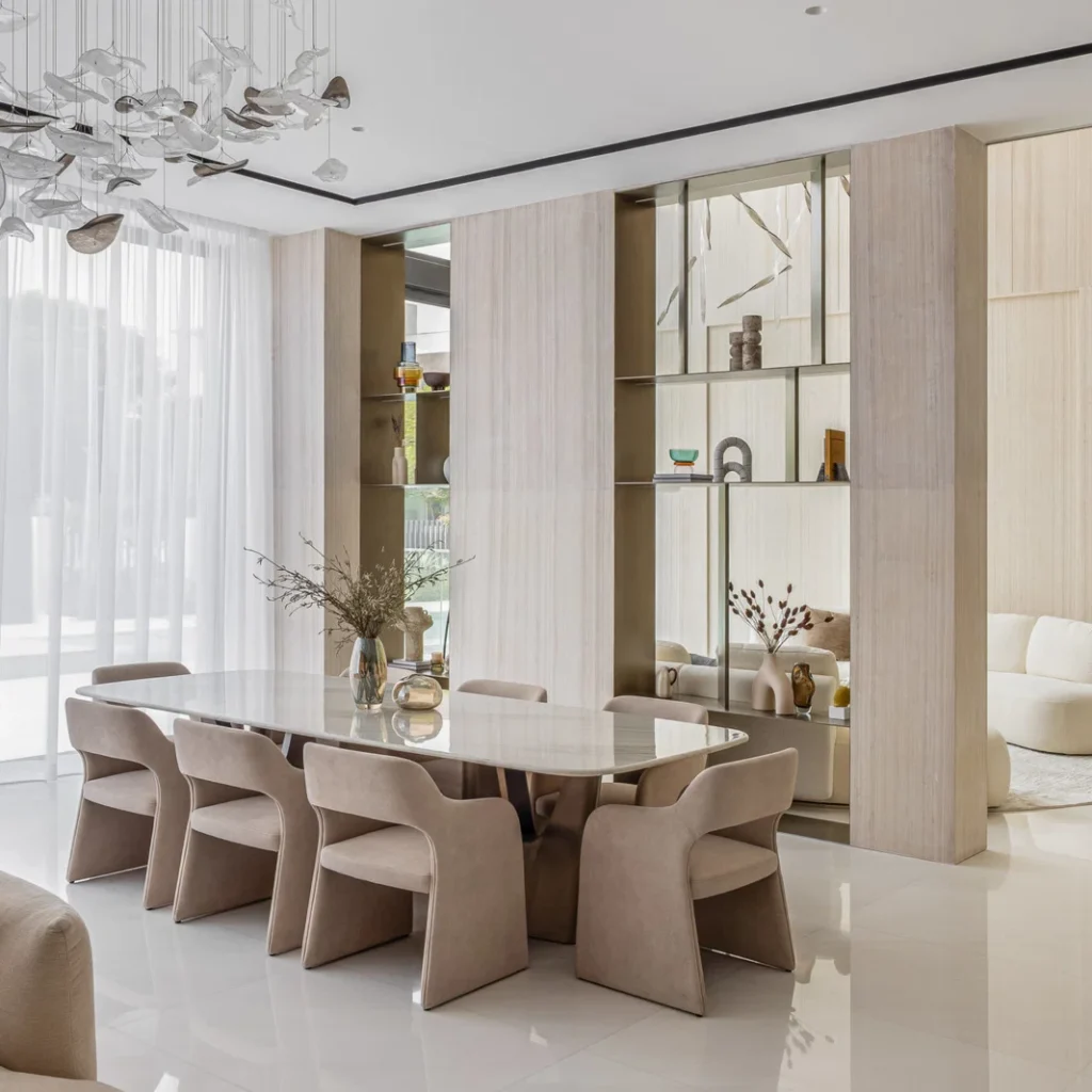 Villa renovation in Dubai formal dining room with custom display walls and contemporary dining furniture