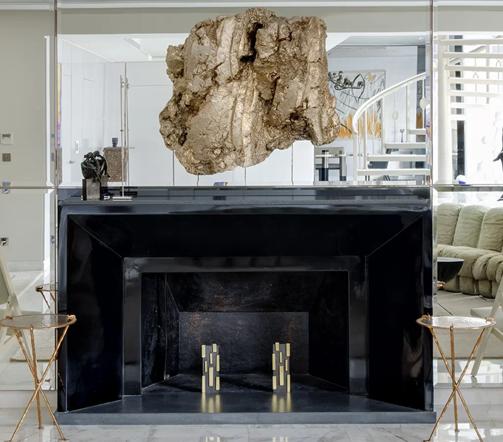 Apartment renovation in Dubai dining room with contemporary table, artwork and statement chandelier