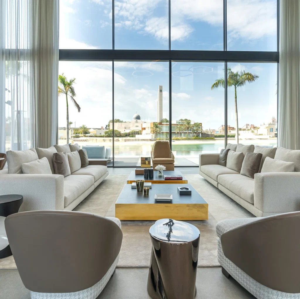 Waterfront villa fit out in Dubai featuring floor-to-ceiling windows and a contemporary living room