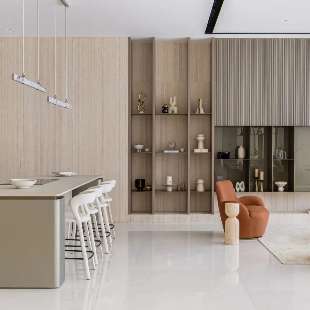 Villa renovation in Dubai with modern kitchen breakfast counter, custom shelving and integrated cabinetry