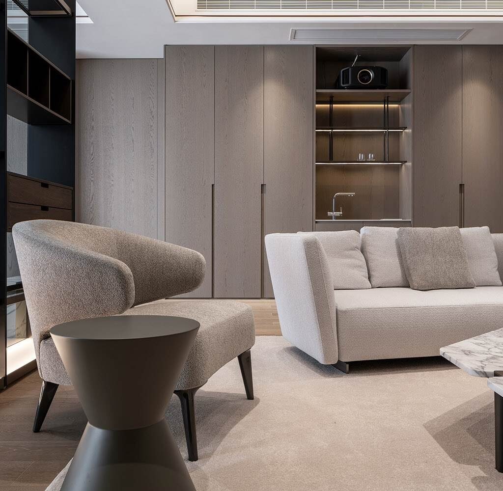 High-end penthouse interior design in Dubai featuring contemporary lounge furniture and custom built-in cabinetry